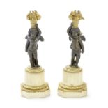 A pair of 19th century French gilt and patinated bronze and white marble figural garnitures proba...