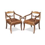 A pair of George IV mahogany and birds' eye maple open armchairs of unusually deep proportions (2)