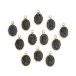 A set of twelve black basalt profile portrait medallions in the Wedgwood style, probably late 19...