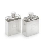 A pair of silver cased glass flasks Samuel Jacob, London, mounted bottles 1907 and sleeves 1912 (2)