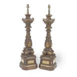 A pair of large late 18th / early 19th century Italian carved and parcel gilt and stained wood al...