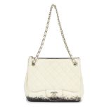 CHANEL: A WHITE AND BLACK LAMBSKIN BLIZZARD ZIP TOP TOTE Autumn 2010 (includes serial sticker and...