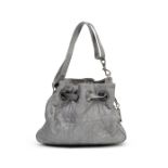 CHRISTIAN DIOR: A SILVER LEATHER CANNAGE DRAWSTRING BAG (includes authenticity card and dust bag)