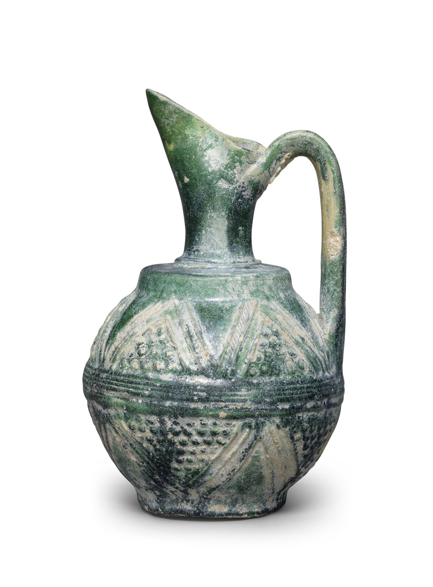 An Umayyad monochrome moulded pottery ewer Syria or Mesopotamia, 8th/ 9th Century