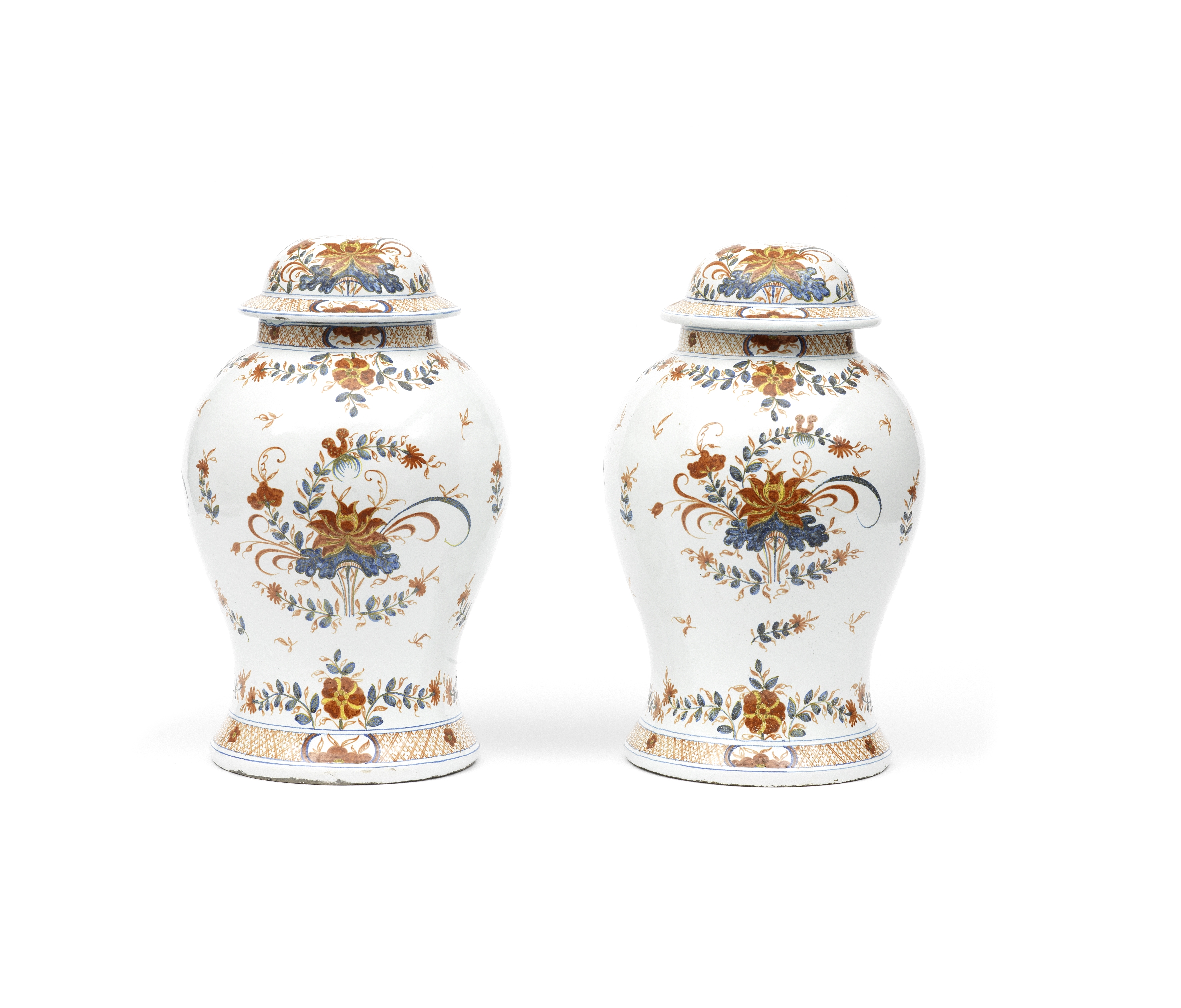 A pair of late 19th/early 20th century Italian faience vases and covers