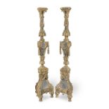A pair of Italian mirror glass-inset carved giltwood torcheres apparently re-constructed from lat...