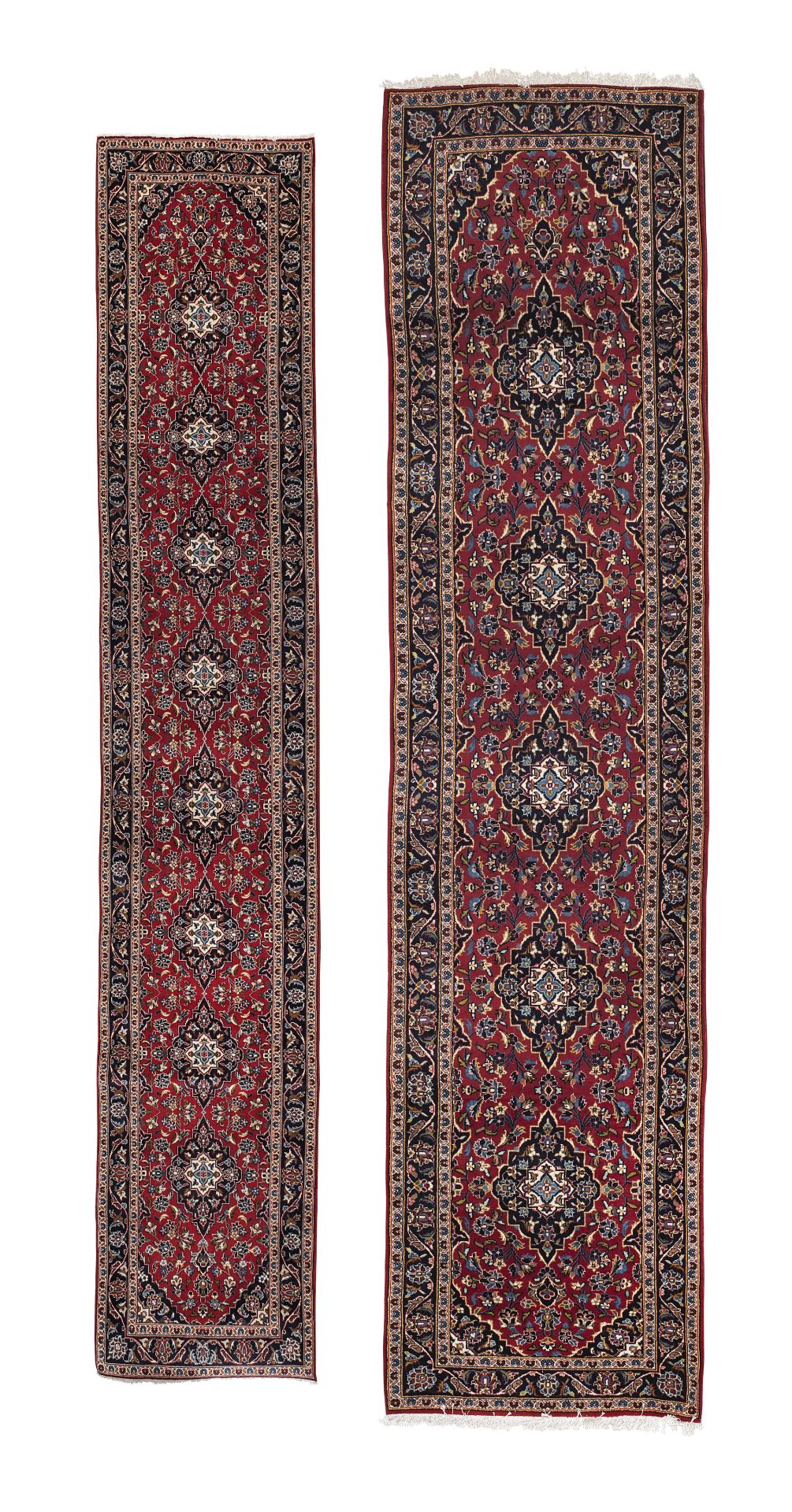 A near pair of Kashan runners Central Persia the largest example 530 x 98cm