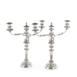 A pair of Old Sheffield Plate three-light candelabra and a pair of candlesticks ensuite early 19t...