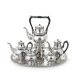 A German six-piece silver tea and coffee service including a kettle on stand and two-handled tra...