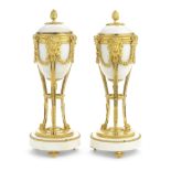 A pair of 19th century French gilt bronze and white marble cassolettes in the Louis XVI style (2)