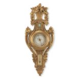 A carved giltwood wall barometer and thermometer in the Louis XVI style, the dial signed J. Blanc...