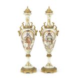 A pair of early 20th century French gilt bronze mounted Sevres style porcelain garniture vases i...