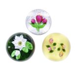 Three Baccarat flower paperweights, dated 1977, 1981 and 1995