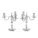 A pair of cast silver three-light candelabra Herbert & Laurie Parsons trading as Tessiers Ltd, Lo...