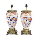 A pair of decorative mid 20th century gilt metal mounted Japanese Imari porcelain urn lamp bases (2)