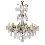 An early 20th century Baccarat cut and moulded glass and gilt brass twelve light chandelier