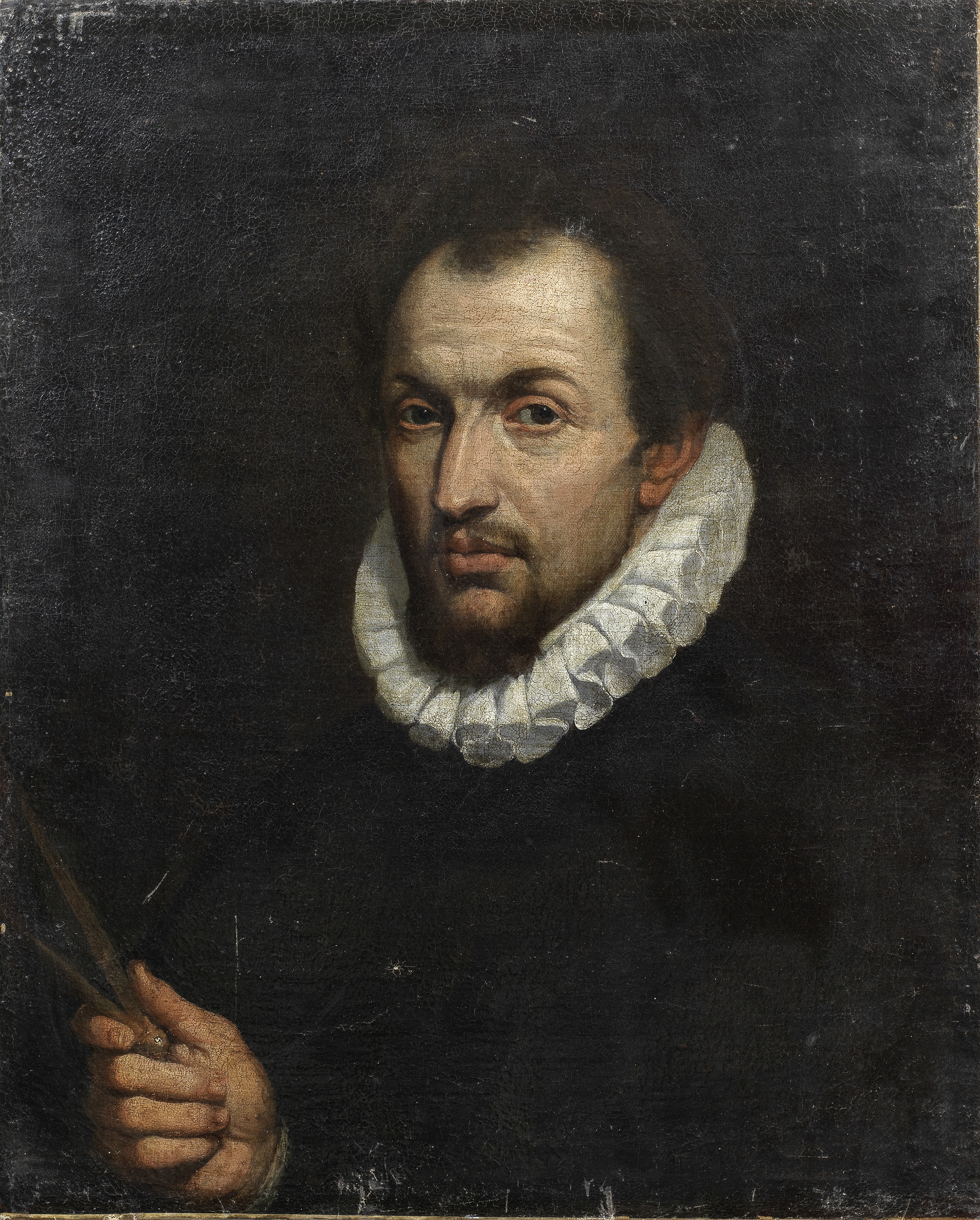 Bolognese School, early 17th Century Portrait of an architect, bust-length, holding a drawing com...