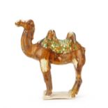 A SANCAI-GLAZED POTTERY CAMEL Tang Dynasty