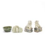 A PALE GREEN JADE 'MOUNTAIN' GROUP, A SPINACH GREEN JADE BOWL AND A PAIR OF 'BUDDHIST LION' CARVI...