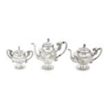 AN EXPORT THREE-PIECE SILVER TEA SERVICE Mark of MH, Canton, 19th century (4)