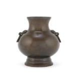 A SMALL BRONZE PEAR-SHAPED VASE, HU Cast Xuande six-character mark, 17th/18th century