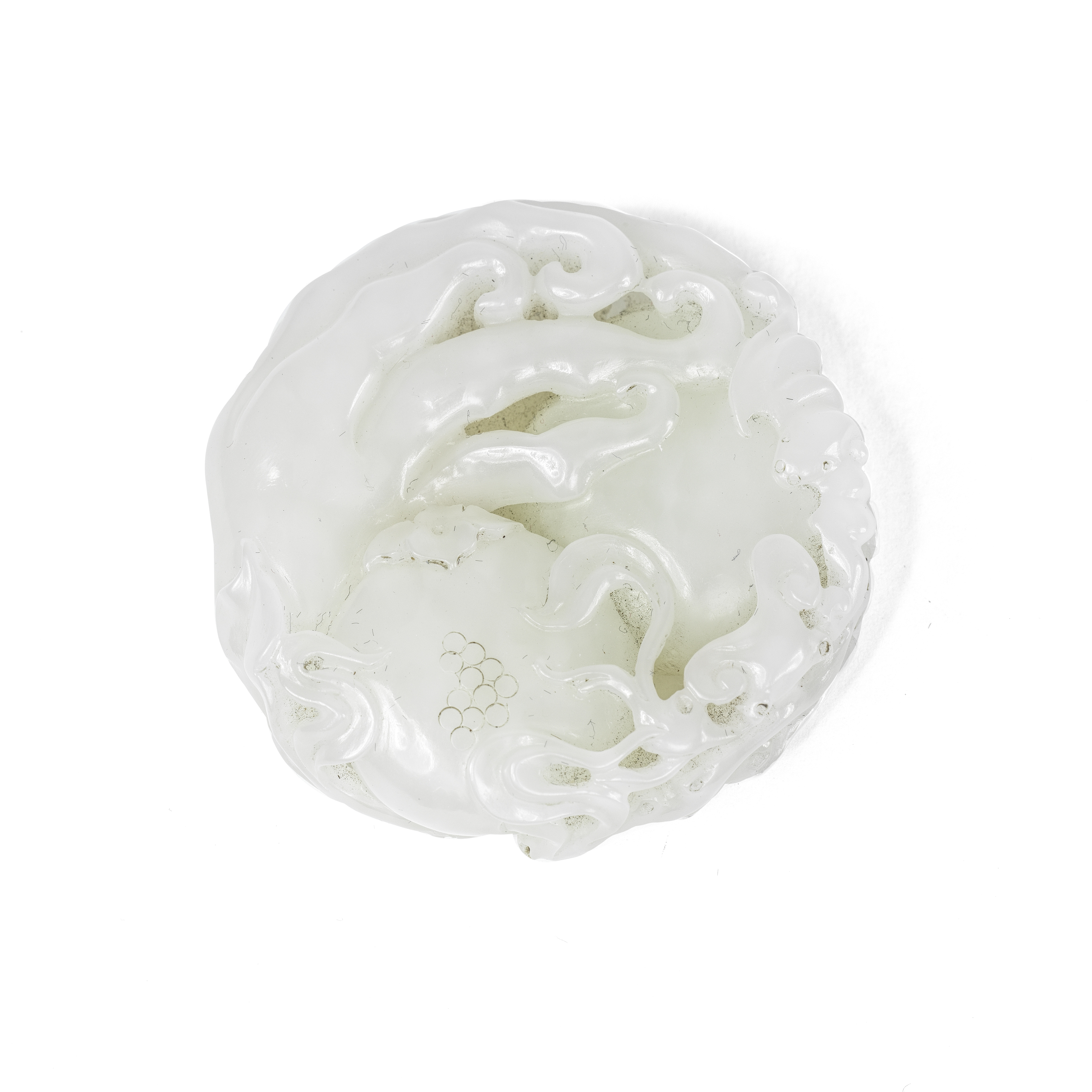 A WHITE JADE CARVING OF AUSPICIOUS FRUITS 20th century