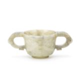 A MOTTLED GREEN JADE ARCHAISTIC TWO-HANDLED CUP Ming Dynasty (2)