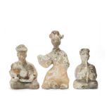 A GROUP OF THREE POTTERY MODELS OF MUSICIANS AND A DANCER Han Dynasty (3)