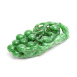 A JADEITE 'SQUIRREL AND GRAPES' PENDANT Early 20th century