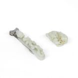 A PALE GREEN JADE BELT HOOK AND A SMALL JADE 'CATS' GROUP 19th century (2)