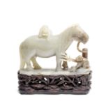 A PALE GREEN JADE 'HORSE AND MONKEYS' GROUP 18th century (2)