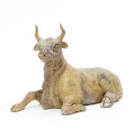 A GREY POTTERY MODEL OF A RECUMBENT OX Tang Dynasty