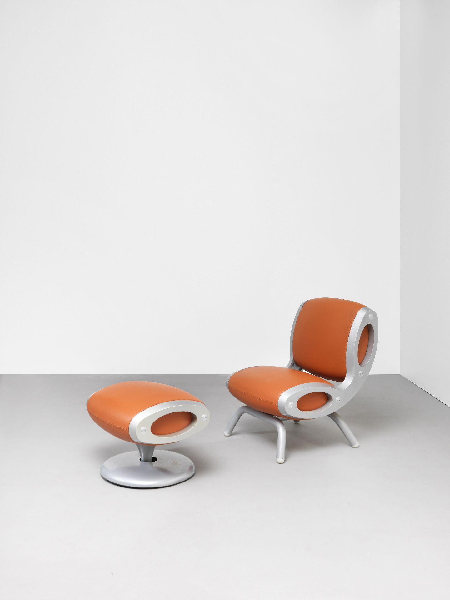 Marc Newson 'Gluon' chair and footstool, designed 1993
