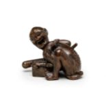 A WOOD OKIMONO (TABLE ORNAMENT) OF A DISAPPOINTED RAT CATCHER Meiji era (1868-1912), late 19th/ea...