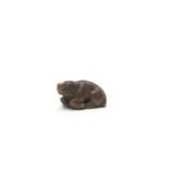 A WOOD NETSUKE OF A RECUMBENT BOAR By Kokei, Kuwana, Ise Province, Edo period (1615-1868), circa ...