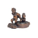 A WOOD NETSUKE OF RAIJIN WITH A BATHING WOMAN By Suketada, Takayama, Hida Province, Edo period (1...