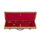 A fine brass-mounted oak and leather guncase by Holland and Holland
