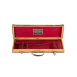 A brass-mounted oak and leather guncase by Henry Atkin with trade-label