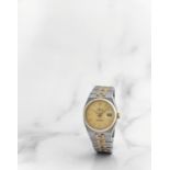 Rolex. Montre bracelet en or jaune 18K (750) et acier avec date mouvement quartz Rolex. A stainle...