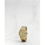 Rolex. Montre bracelet en or jaune 18K (750) avec date mouvement automatique Rolex. An 18K gold a...