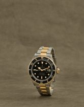 Rolex. Montre bracelet en or jaune 18K (750) et acier avec date mouvement automatique Rolex. A st...