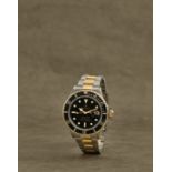 Rolex. Montre bracelet en or jaune 18K (750) et acier avec date mouvement automatique Rolex. A st...