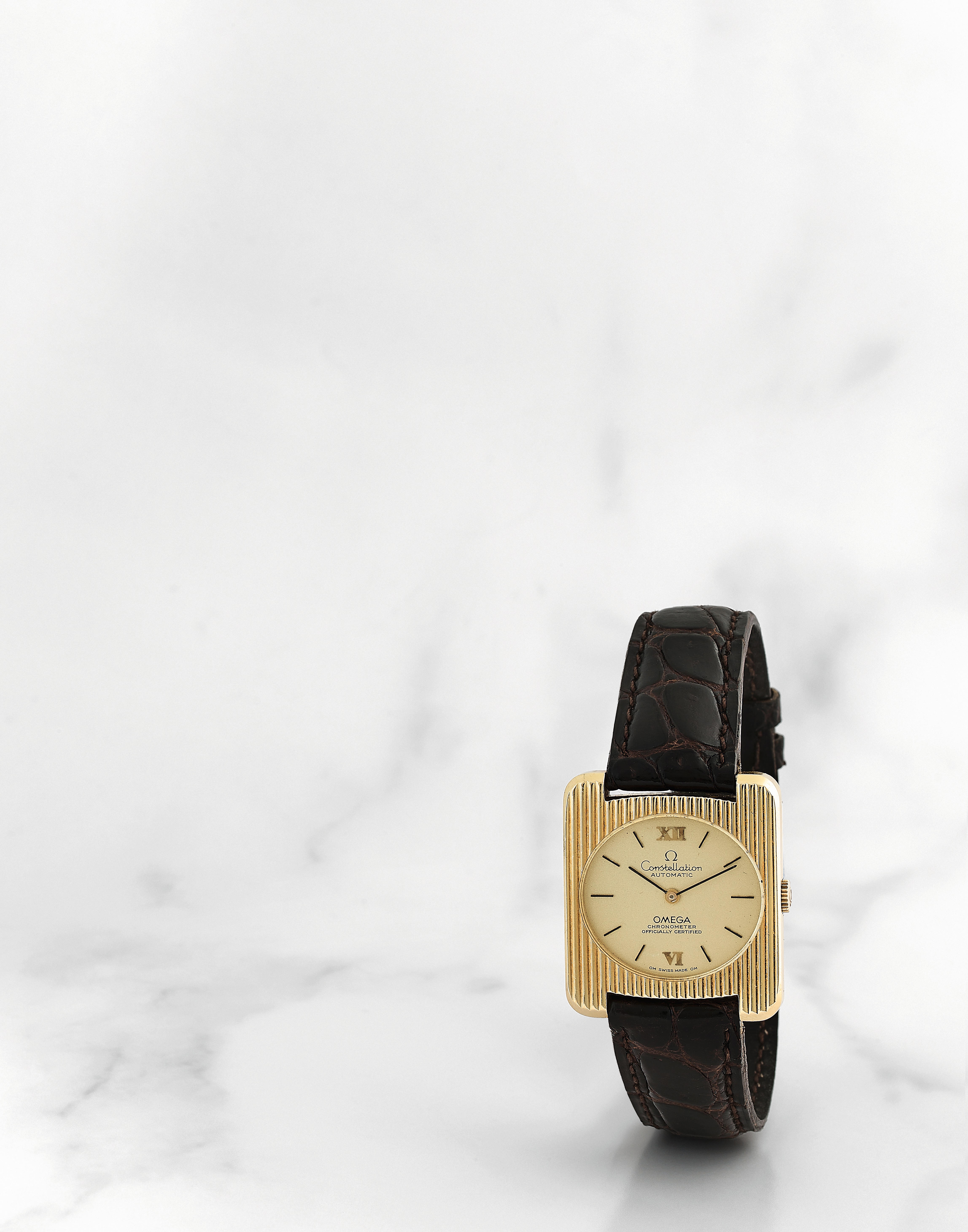 Omega. Montre bracelet en or jaune 18K (750) de taille medium mouvement automatique Omega. A mid-...