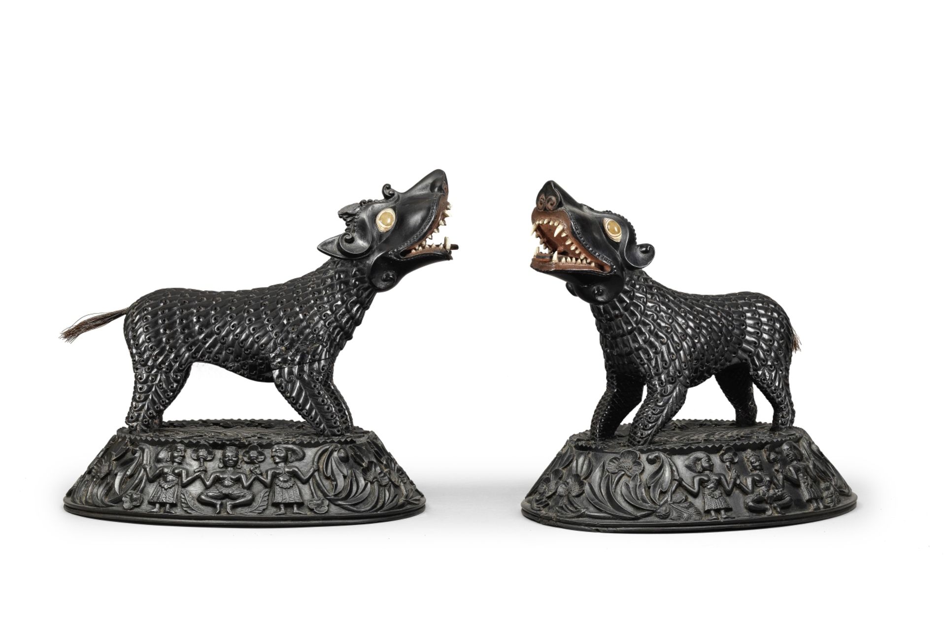 A pair of ivory-inlaid ebony mythical lions Madampe, Ceylon, dated 1848(2)