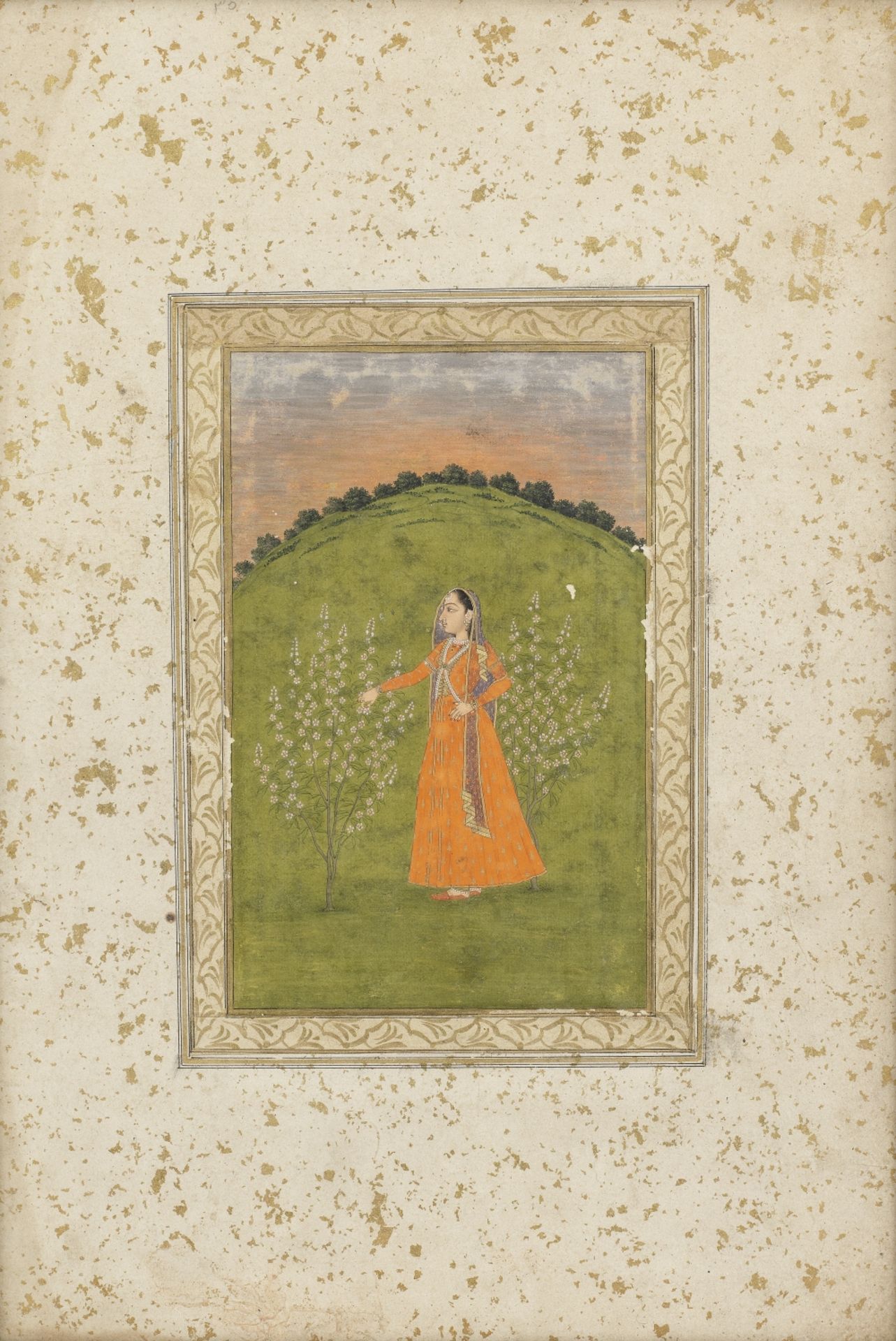 A maiden standing between two blossoming trees in a landscape Deccan, late 17th/18th Century