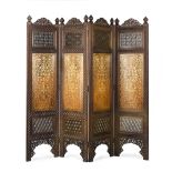 A brass-inlaid carved wood four-leaf screen Punjab, probably Lahore, circa 1900