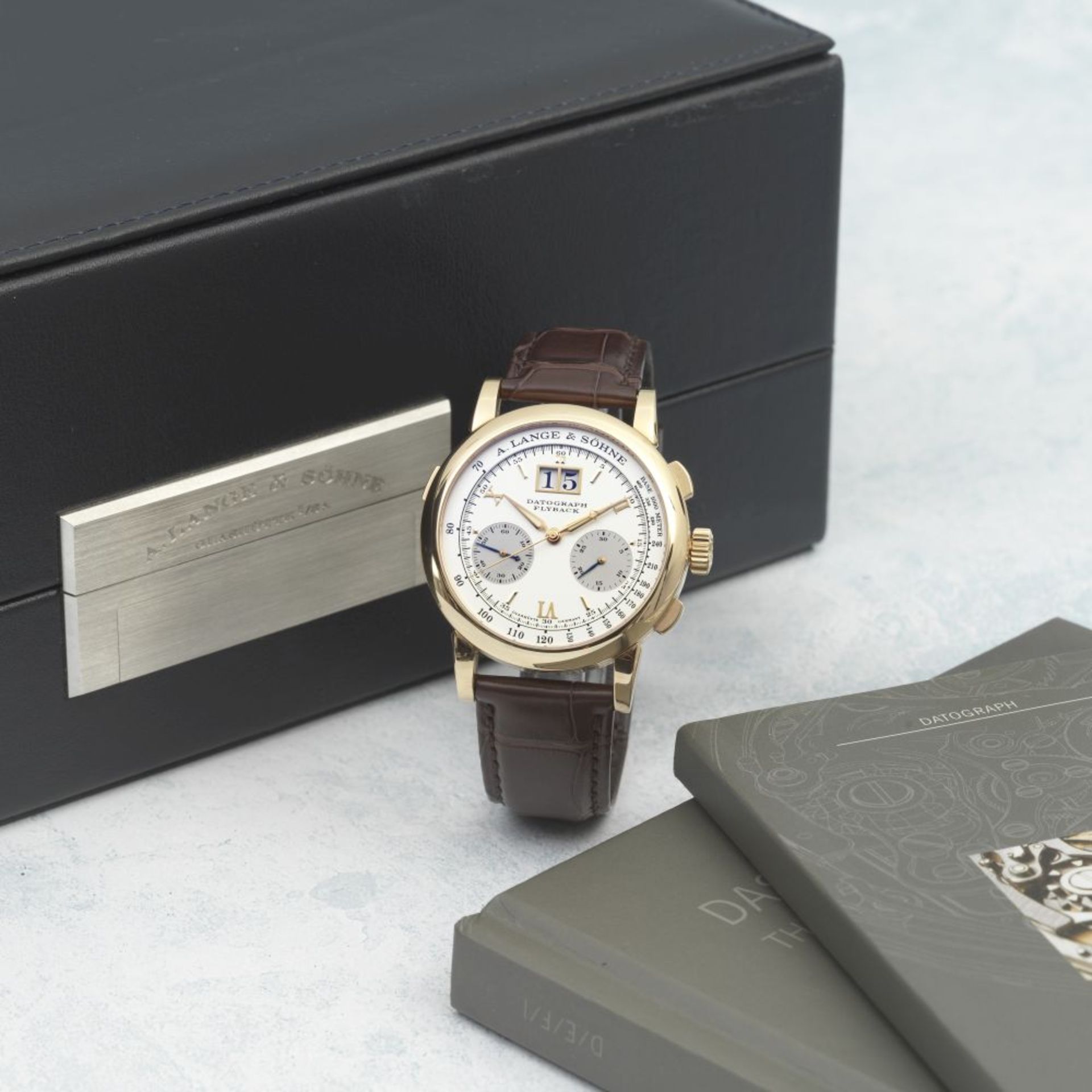 A. Lange & S&#246;hne. A fine 18K gold manual wind calendar chronograph wristwatch Datograph Fly...