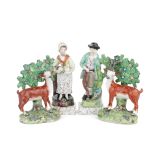 A pair of Staffordshire models of deer and a pair of figures of harvesters, circa 1815-20