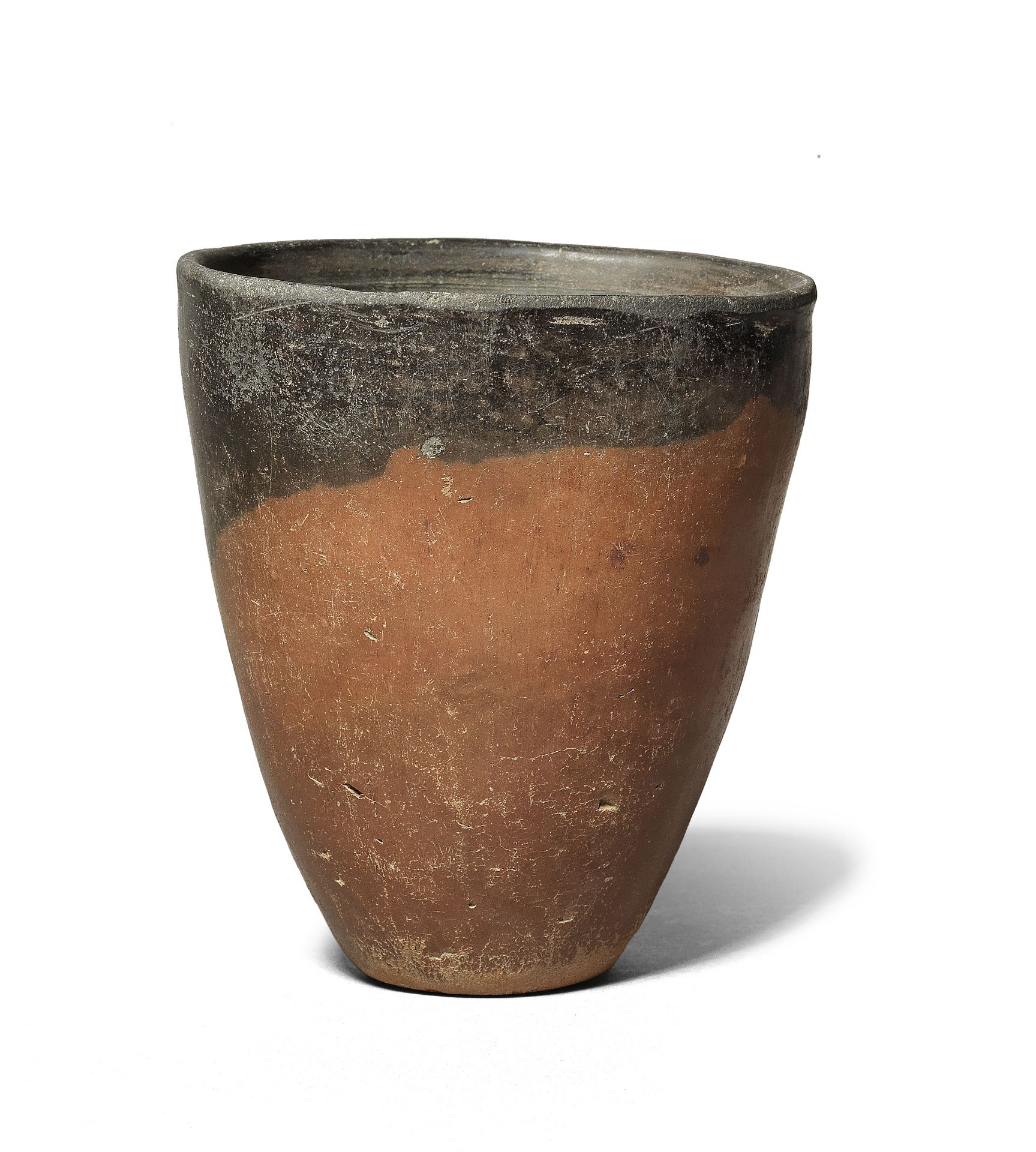 An Egyptian black-topped pottery jar