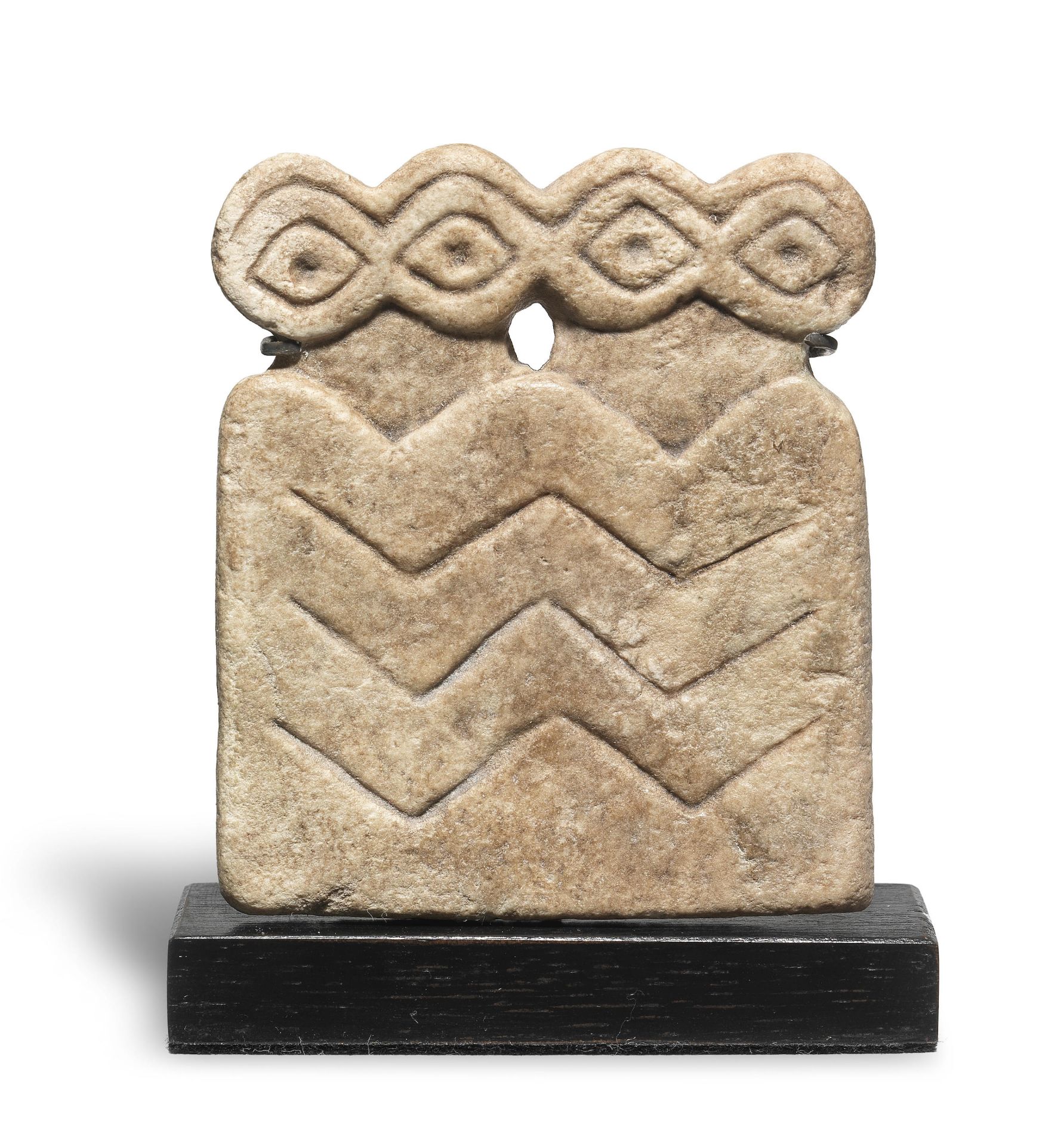 A Mesopotamian marble double 'eye' idol